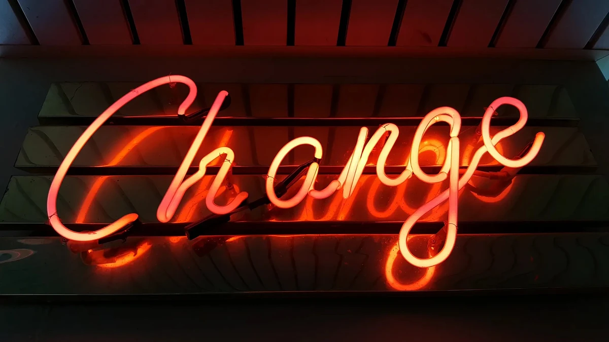 A neon sign that spells out the word "Change"